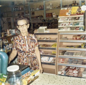 1973.10.11 Anna behind counter Grandma Anna on auction day.