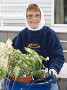 Layered Sweatshirts Char gardening on the back deck, May 24, 2011
